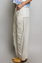 POL Designed in high rise wide pants in denim/twill with lace on top patch, outseam detail, floral metal button detail, solid color - Oatmilk.