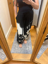 POL black pants, relaxed fit in rib with patch detail pointed solid pattern.