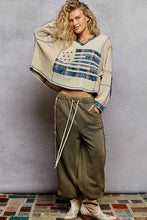 POL Designed in V-neck, balloon sleeve, oversized fit top in thermal with stud and trim detail pointed plaid pattern - Oatmeal