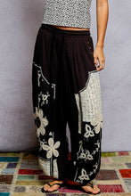POL black pants, relaxed fit in rib with patch detail pointed solid pattern.