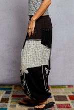 POL black pants, relaxed fit in rib with patch detail pointed solid pattern.