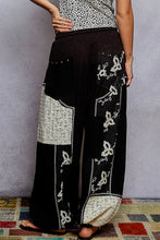 POL black pants, relaxed fit in rib with patch detail pointed solid pattern.