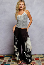 POL black pants, relaxed fit in rib with patch detail pointed solid pattern.