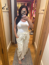POL Designed in high rise wide pants in denim/twill with lace on top patch, outseam detail, floral metal button detail, solid color - Oatmilk.