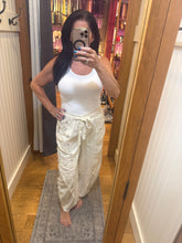POL Designed in high rise wide pants in denim/twill with lace on top patch, outseam detail, floral metal button detail, solid color - Oatmilk.