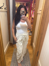 POL Designed in high rise wide pants in denim/twill with lace on top patch, outseam detail, floral metal button detail, solid color - Oatmilk.
