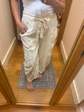 POL Designed in high rise wide pants in denim/twill with lace on top patch, outseam detail, floral metal button detail, solid color - Oatmilk.